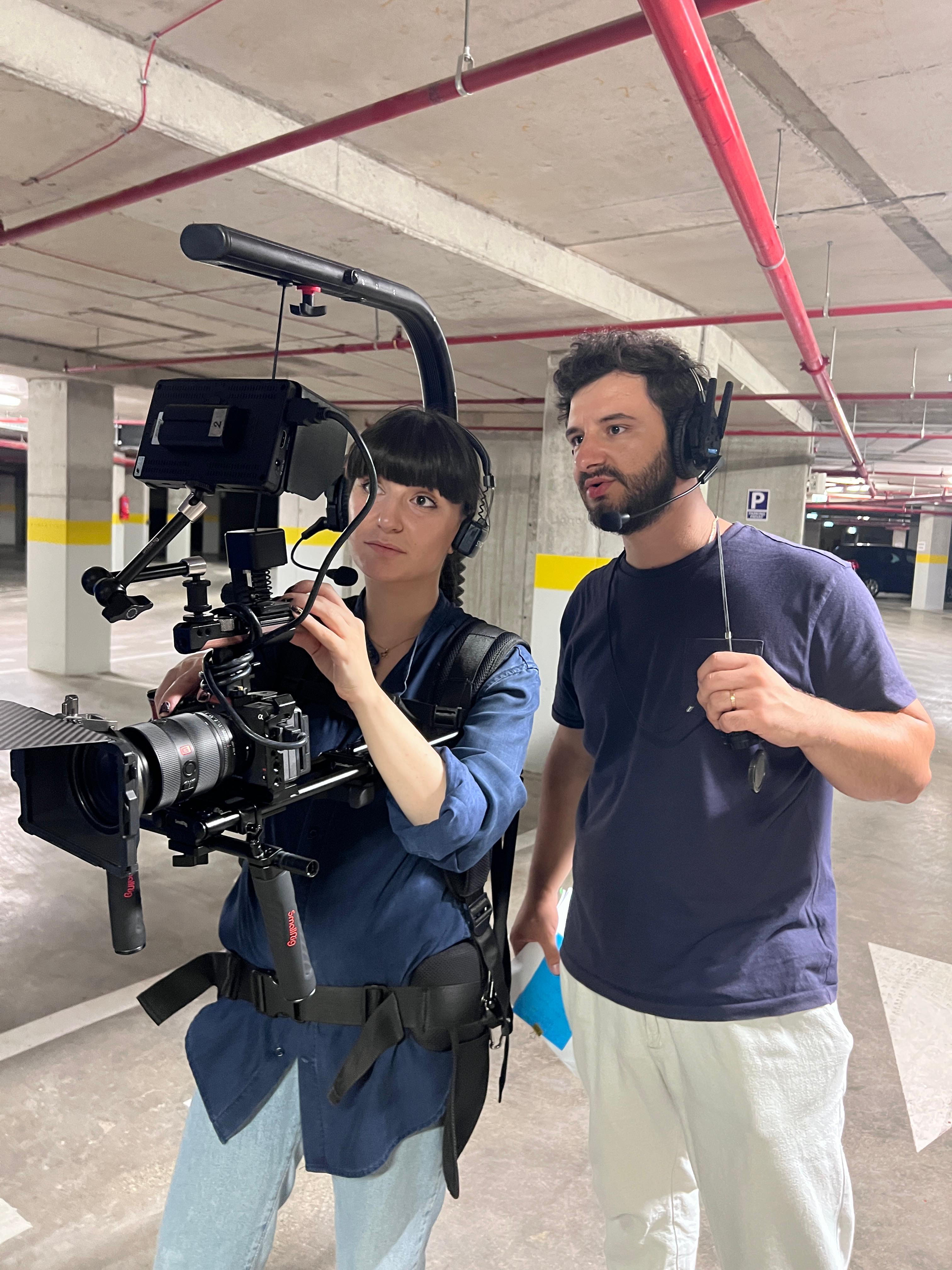 vivFilms crew filming in a parking garage location